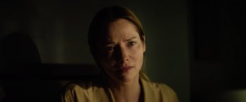 Movie still from “A Banquet” (2021), directed by Ruth Paxton – A person wearing a yellow shirt; Close Up shot, Low angle