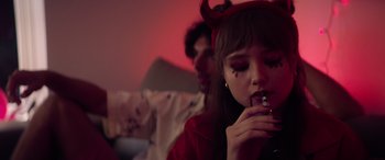 Movie still from “A Banquet” (2021), directed by Ruth Paxton – A woman with horns on her head and a man with horns on his head; Close Up shot, Over the shoulder angle