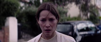 Movie still from “A Banquet” (2021), directed by Ruth Paxton – A person wearing a white shirt; Close Up shot, Over the shoulder angle