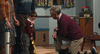 Movie still from “A Beautiful Day in the Neighborhood” (2019), directed by Marielle Heller – An older man and a young boy playing a game; Medium shot, Over the shoulder angle