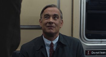 Movie still from “A Beautiful Day in the Neighborhood” (2019), directed by Marielle Heller – A person wearing a suit and tie; Close Up shot, Low angle