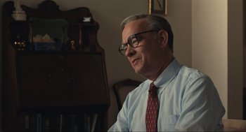Movie still from “A Beautiful Day in the Neighborhood” (2019), directed by Marielle Heller – An older man wearing glasses and wearing a tie; Close Up shot, Over the shoulder angle