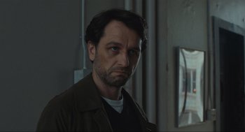 Movie still from “A Beautiful Day in the Neighborhood” (2019), directed by Marielle Heller – A person wearing a jacket and looking at the camera; Close Up shot, Over the shoulder angle