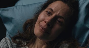 Movie still from “A Beautiful Day in the Neighborhood” (2019), directed by Marielle Heller – A person laying on a bed; Close Up shot, High angle