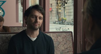 Movie still from “A Beautiful Day in the Neighborhood” (2019), directed by Marielle Heller – A man sitting in front of a window in a restaurant; Close Up shot, Over the shoulder angle