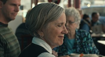 Movie still from “A Beautiful Day in the Neighborhood” (2019), directed by Marielle Heller – An older woman is looking to her left; Close Up shot, Over the shoulder angle