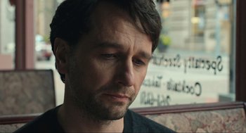 Movie still from “A Beautiful Day in the Neighborhood” (2019), directed by Marielle Heller – A person looking down; Close Up shot, Over the shoulder angle