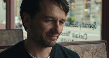 Movie still from “A Beautiful Day in the Neighborhood” (2019), directed by Marielle Heller – A person sitting in a chair; Close Up shot, Over the shoulder angle