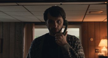 Movie still from “A Beautiful Day in the Neighborhood” (2019), directed by Marielle Heller – A man holding a phone up to his ear; Close Up shot, Low angle