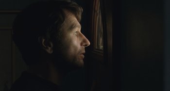 Movie still from “A Beautiful Day in the Neighborhood” (2019), directed by Marielle Heller – A person looking out of a window; Close Up shot, Over the shoulder angle