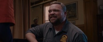 Movie still from “A Christmas Mystery” (2022), directed by Alex Ranarivelo – A person wearing a uniform; Close Up shot, Over the shoulder angle