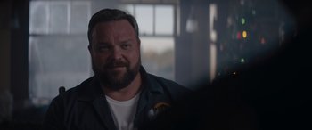 Movie still from “A Christmas Mystery” (2022), directed by Alex Ranarivelo – A person with a beard; Close Up shot, Over the shoulder angle