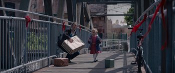 Movie still from “A Christmas Mystery” (2022), directed by Alex Ranarivelo – A woman and a little girl are on a bridge; Wide shot, Over the shoulder angle