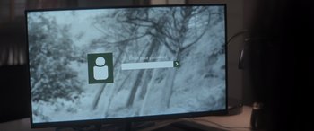 Movie still from “A Christmas Mystery” (2022), directed by Alex Ranarivelo – A computer screen showing a login screen; Extreme Close Up shot, Over the shoulder angle