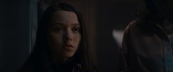 Movie still from “A Christmas Mystery” (2022), directed by Alex Ranarivelo – A young girl is looking at the camera; Close Up shot, Low angle