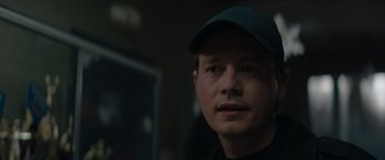 Movie still from “A Christmas Mystery” (2022), directed by Alex Ranarivelo – A person wearing a hat; Close Up shot, Over the shoulder angle