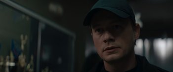 Movie still from “A Christmas Mystery” (2022), directed by Alex Ranarivelo – A person wearing a hat; Close Up shot, Low angle