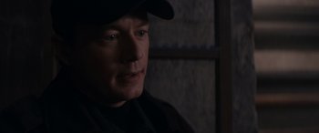 Movie still from “A Christmas Mystery” (2022), directed by Alex Ranarivelo – A person wearing a hat; Close Up shot, Over the shoulder angle