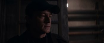 Movie still from “A Christmas Mystery” (2022), directed by Alex Ranarivelo – A person wearing a hat; Close Up shot, Low angle