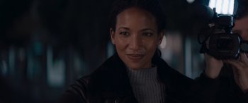 Movie still from “A Christmas Mystery” (2022), directed by Alex Ranarivelo – A person wearing a leather jacket; Close Up shot, Over the shoulder angle