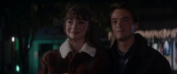Movie still from “A Christmas Mystery” (2022), directed by Alex Ranarivelo – A woman and a young man standing next to each other; Close Up shot, Over the shoulder angle
