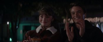 Movie still from “A Christmas Mystery” (2022), directed by Alex Ranarivelo – A woman in a brown jacket and a man in a brown jacket; Medium shot, Over the shoulder angle