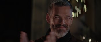 Movie still from “A Christmas Mystery” (2022), directed by Alex Ranarivelo – A person with grey hair; Close Up shot, Over the shoulder angle