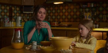 Movie still from “A Christmas Story Christmas” (2022), directed by Clay Kaytis – A woman sitting at a table with a young girl; Medium shot, Over the shoulder angle