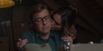 Movie still from “A Christmas Story Christmas” (2022), directed by Clay Kaytis – A man and a woman are kissing in a dark room; Close Up shot, Over the shoulder angle