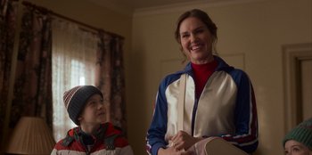 Movie still from “A Christmas Story Christmas” (2022), directed by Clay Kaytis – A woman standing next to a young boy in front of a window; Medium shot, Over the shoulder angle