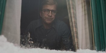 Movie still from “A Christmas Story Christmas” (2022), directed by Clay Kaytis – A man wearing glasses looking out of a window; Close Up shot, Low angle