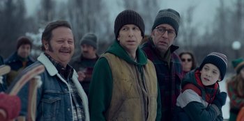 Movie still from “A Christmas Story Christmas” (2022), directed by Clay Kaytis – A group of people standing next to each other in the snow; Medium shot, Over the shoulder angle