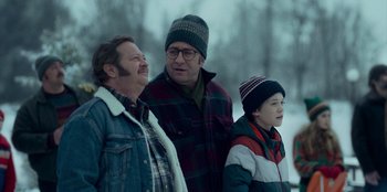 Movie still from “A Christmas Story Christmas” (2022), directed by Clay Kaytis – Three men standing next to each other in the snow; Medium shot, Over the shoulder angle