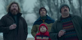 Movie still from “A Christmas Story Christmas” (2022), directed by Clay Kaytis – A group of people standing next to each other in the snow; Medium shot, Low angle