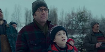 Movie still from “A Christmas Story Christmas” (2022), directed by Clay Kaytis – A man and a boy are standing in the snow; Close Up shot, Low angle