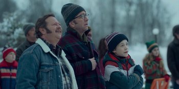 Movie still from “A Christmas Story Christmas” (2022), directed by Clay Kaytis – A group of people standing next to each other; Medium shot, Over the shoulder angle