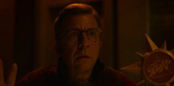 Movie still from “A Christmas Story Christmas” (2022), directed by Clay Kaytis – An older man wearing glasses stares into the camera; Close Up shot, Low angle
