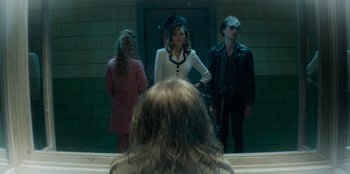 Movie still from “A Christmas Story Christmas” (2022), directed by Clay Kaytis – A group of people standing in front of a mirror; Medium shot, Over the shoulder angle