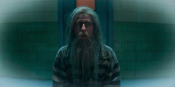 Movie still from “A Christmas Story Christmas” (2022), directed by Clay Kaytis – A man with a long beard is staring at the camera; Medium shot, Low angle