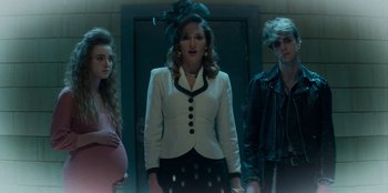 Movie still from “A Christmas Story Christmas” (2022), directed by Clay Kaytis – A group of people standing next to each other in front of a door; Medium shot, Low angle