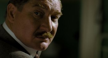 Movie still from “The Fall” (2006), directed by Tarsem Singh – An older man with a mustache and a mustache brush; Close Up shot, Over the shoulder angle