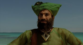 Movie still from “The Fall” (2006), directed by Tarsem Singh – A man with a beard and a green turban; Close Up shot, Low angle