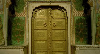 Movie still from “The Fall” (2006), directed by Tarsem Singh – A large golden door in the middle of a room; Extreme Close Up shot, High angle