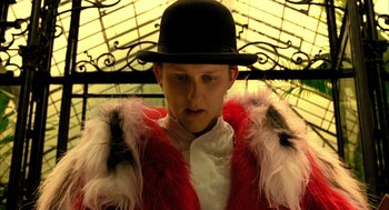 Movie still from “The Fall” (2006), directed by Tarsem Singh – A man wearing a top hat and a red jacket; Close Up shot, Low angle