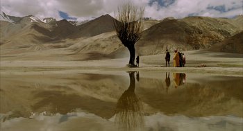Movie still from “The Fall” (2006), directed by Tarsem Singh – A group of people standing next to a body of water; Extreme Wide shot, Low angle