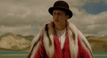 Movie still from “The Fall” (2006), directed by Tarsem Singh – A man wearing a hat and a fur coat; Medium shot, Low angle