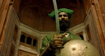 Movie still from “The Fall” (2006), directed by Tarsem Singh – A man with a beard holding a sword and a shield; Medium shot, Low angle