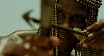 Movie still from “The Fall” (2006), directed by Tarsem Singh – A person holding a sword; Close Up shot, Low angle