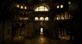 Movie still from “The Fall” (2006), directed by Tarsem Singh – A large room with two large clocks on the wall; Extreme Wide shot, High angle
