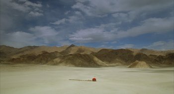 Movie still from “The Fall” (2006), directed by Tarsem Singh – A red house in the middle of the desert; Extreme Wide shot, High angle